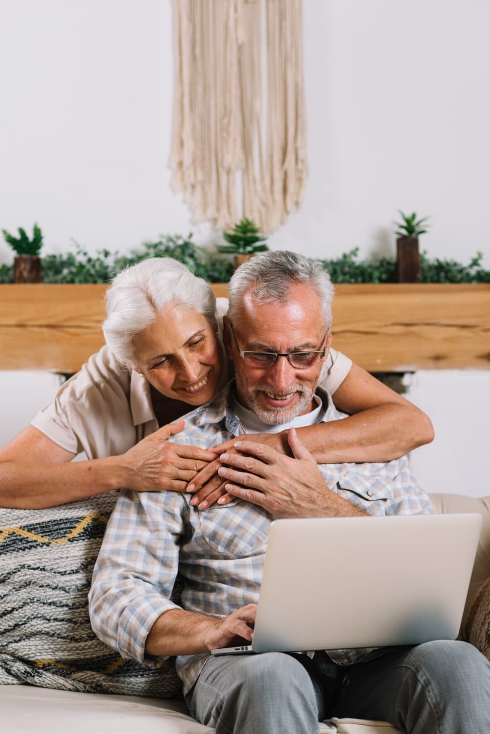 Elderly couple enjoying their home